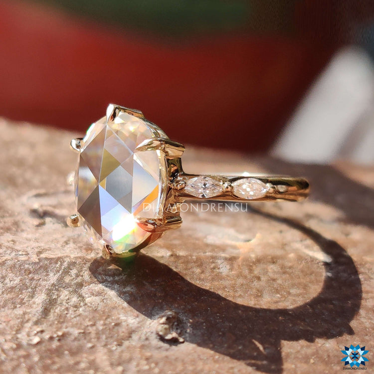 Floating pave setting engagement ring with marquise accents.