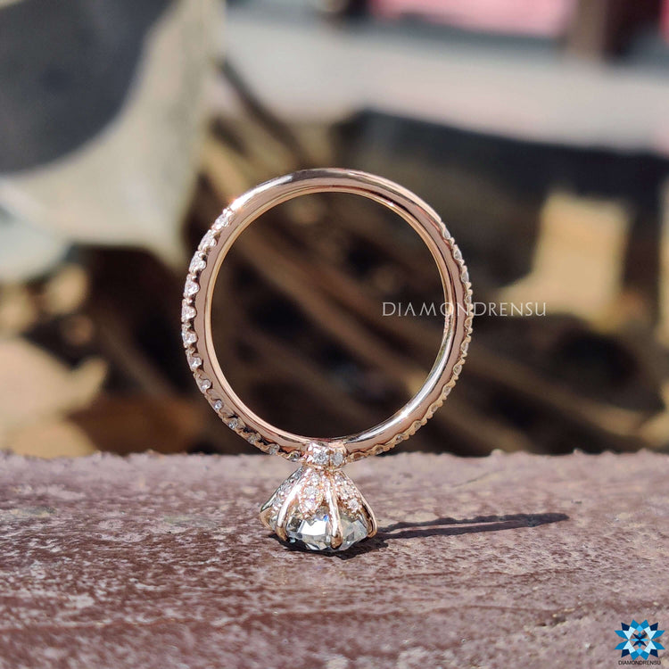 Custom engagement ring featuring oval crushed ice moissanite.