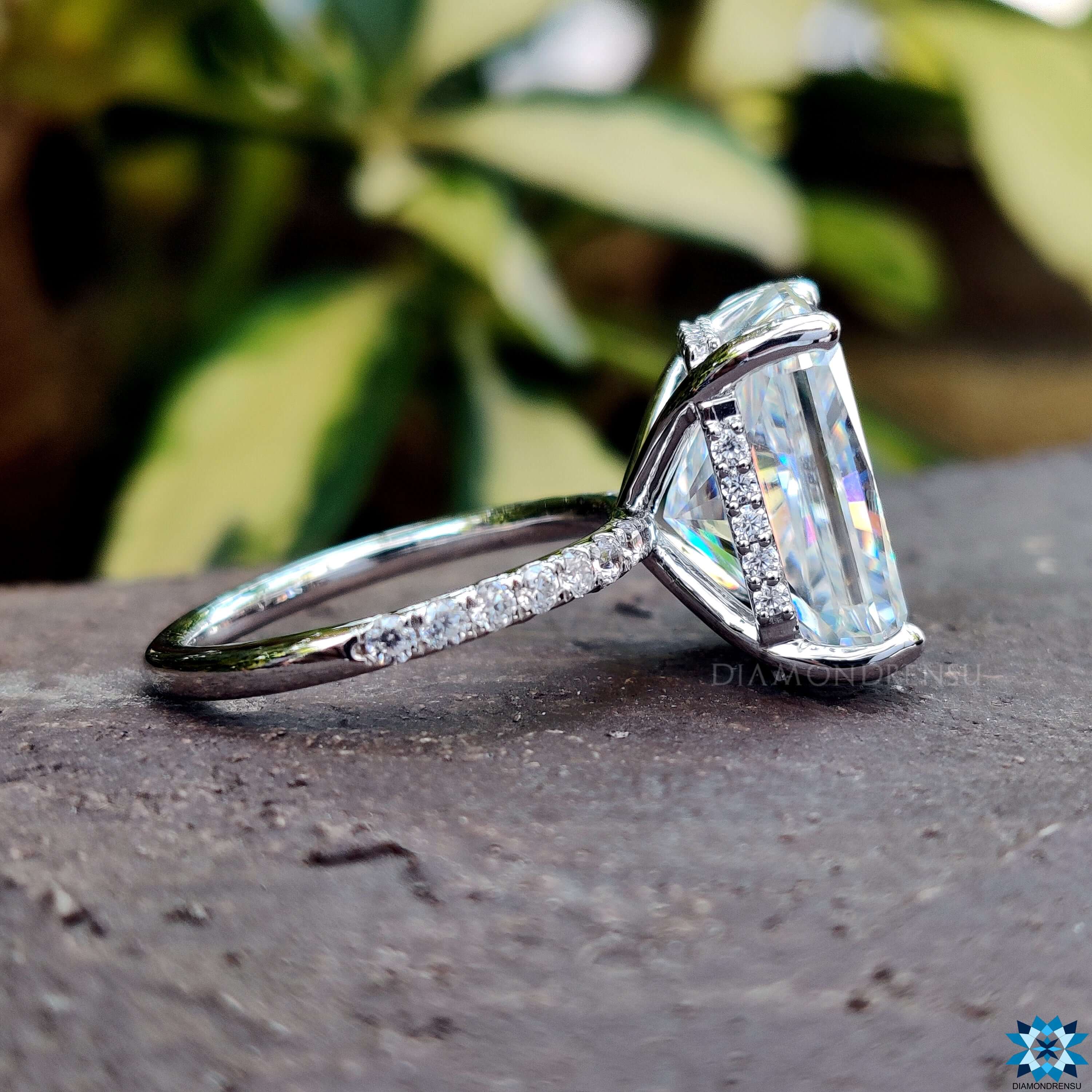 Handmade white gold ring with elongated radiant cut center.