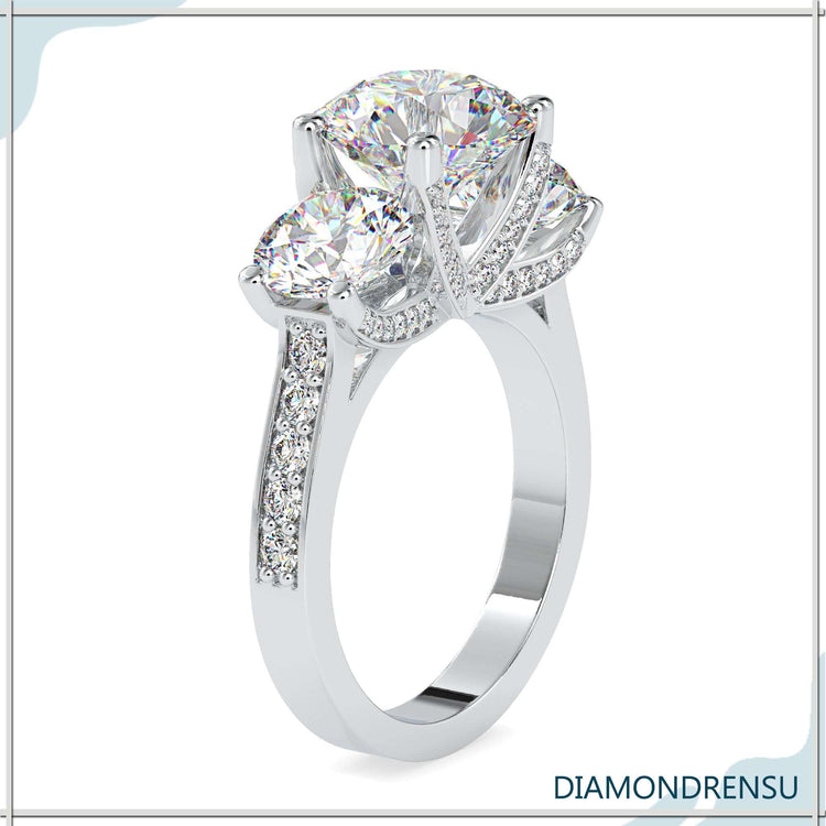 White gold diamond ring with 3 stone and round prong setting.