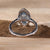 Marquise engagement ring showcasing a marquise cut and intricate pave diamonds.