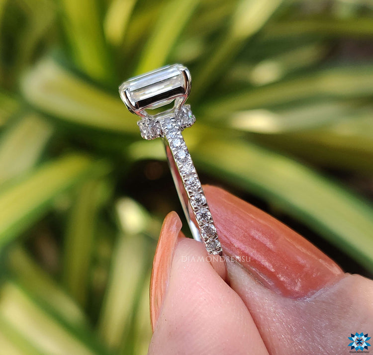 Moissanite pave ring featuring a stunning emerald cut moissanite centre.