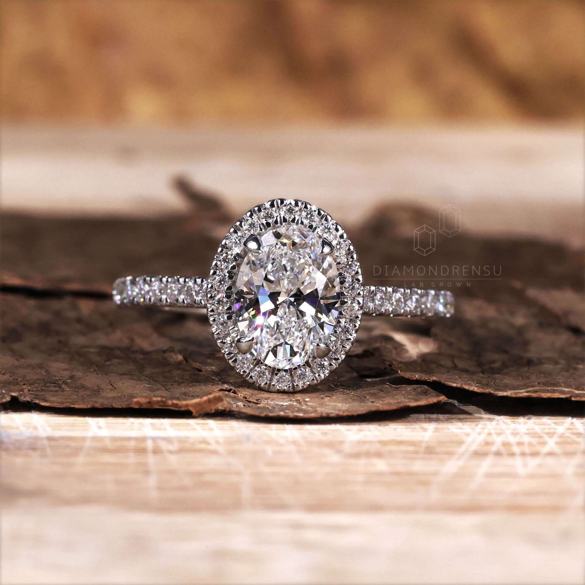 Halo oval ring engagement with claw prong setting for added brilliance.