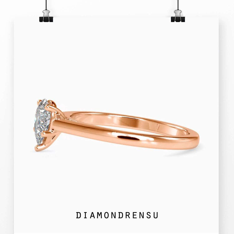 UK engagement ring with pear shape and prong setting.