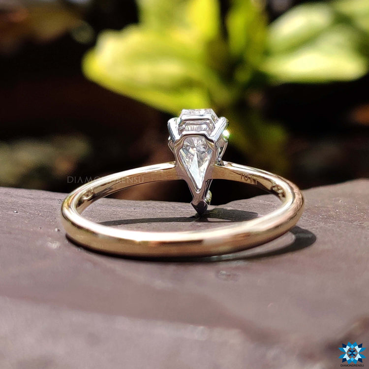 Handmade moissanite ring in two tone gold.