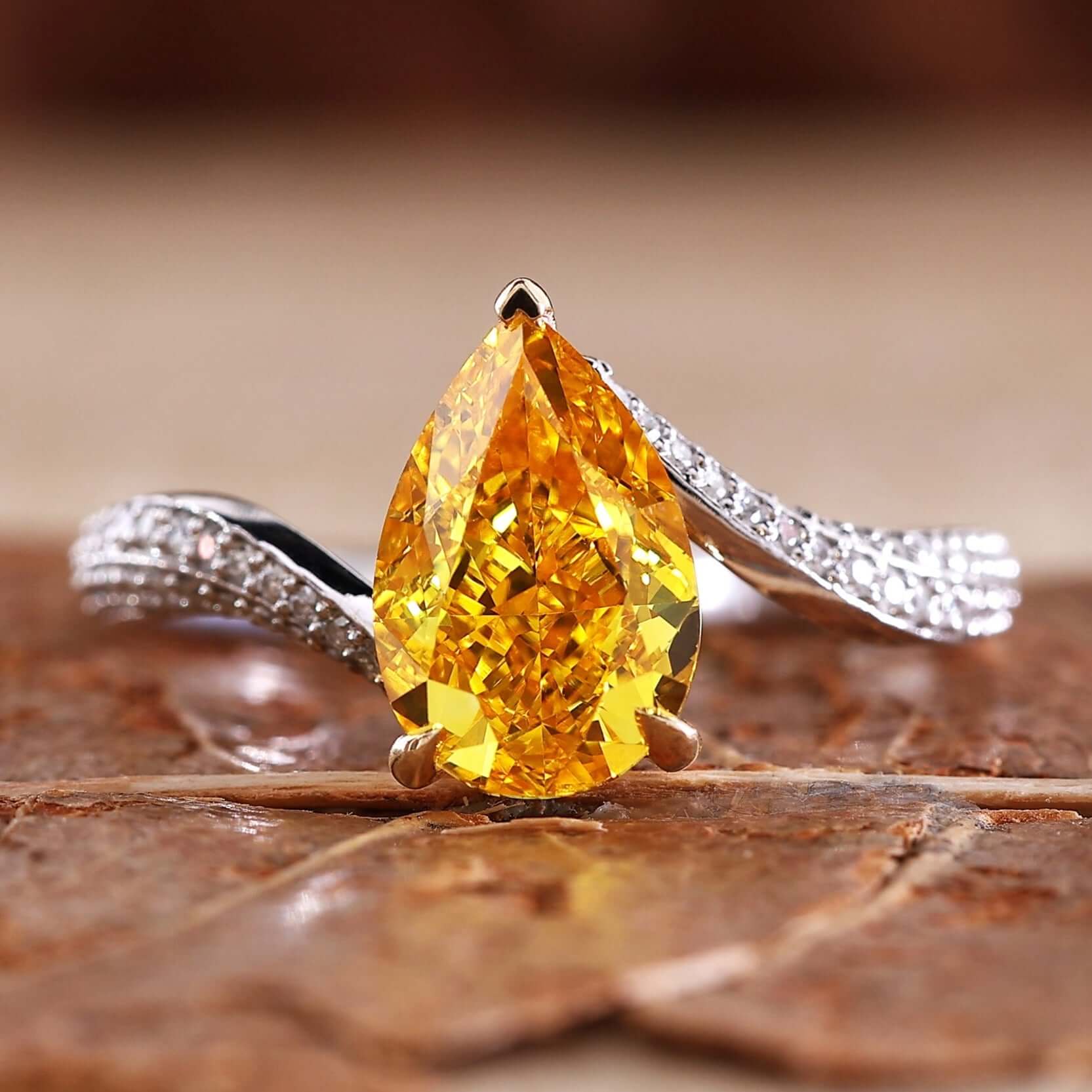 Pear shaped ring diamond in a stunning bypass ring design
