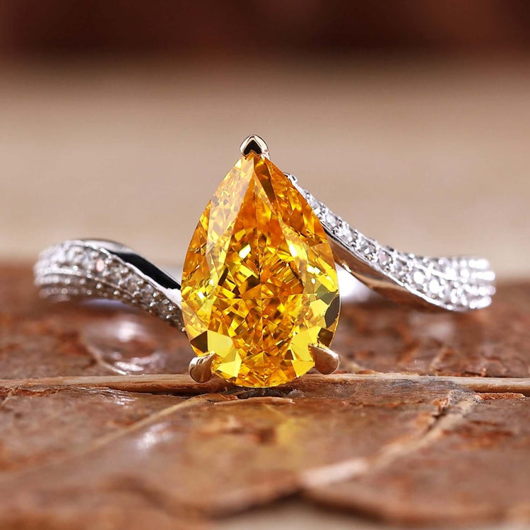 Pear shaped ring diamond in a stunning bypass ring design