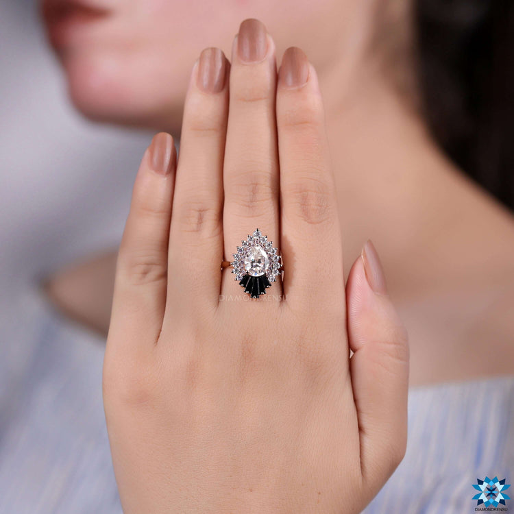 Pear cut moissanite ring with halo setting.