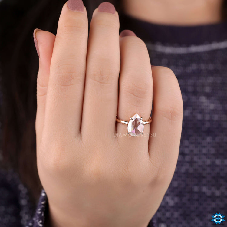 Pear rose cut solitaire engagement ring.