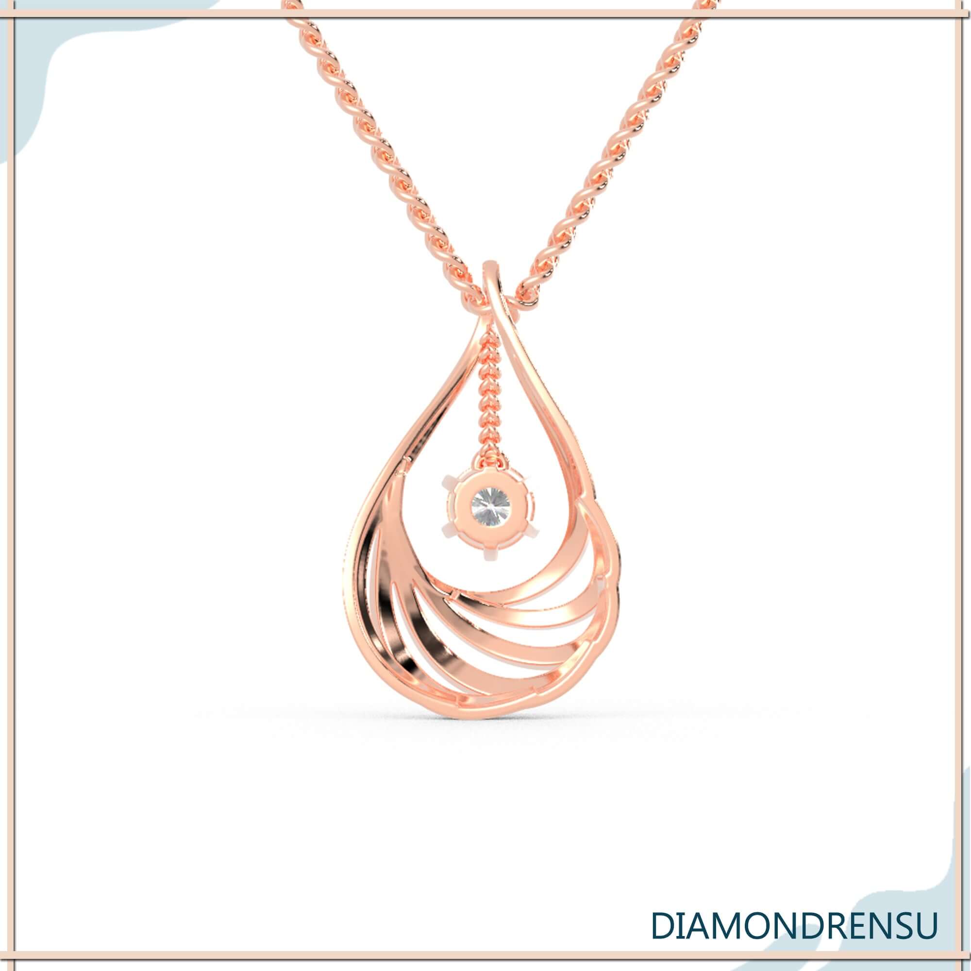 Lab grown diamond pendant in sunburst halo teardrop style.
