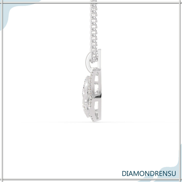 Paw pendant with lab grown diamond in white gold setting.