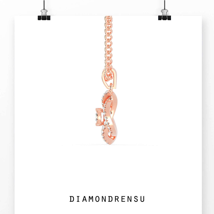 Rose gold halo pendant featuring round lab grown diamond.