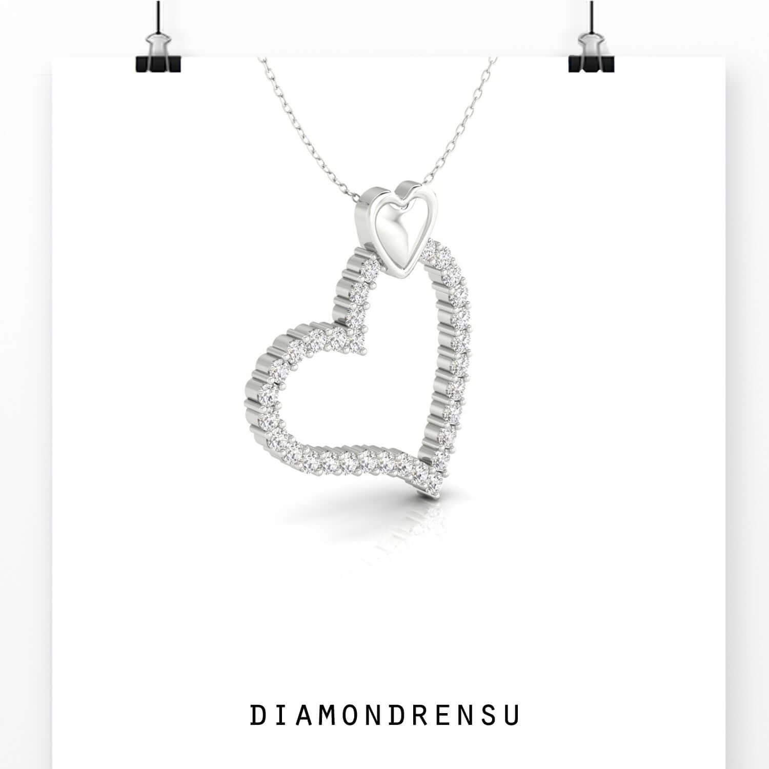 Stylish heart shape pendant in rose gold with sparkling centre.