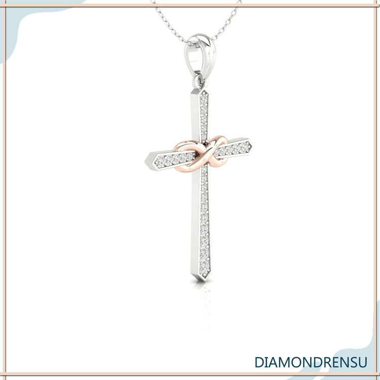 White gold pendant featuring cross and lab grown diamond.