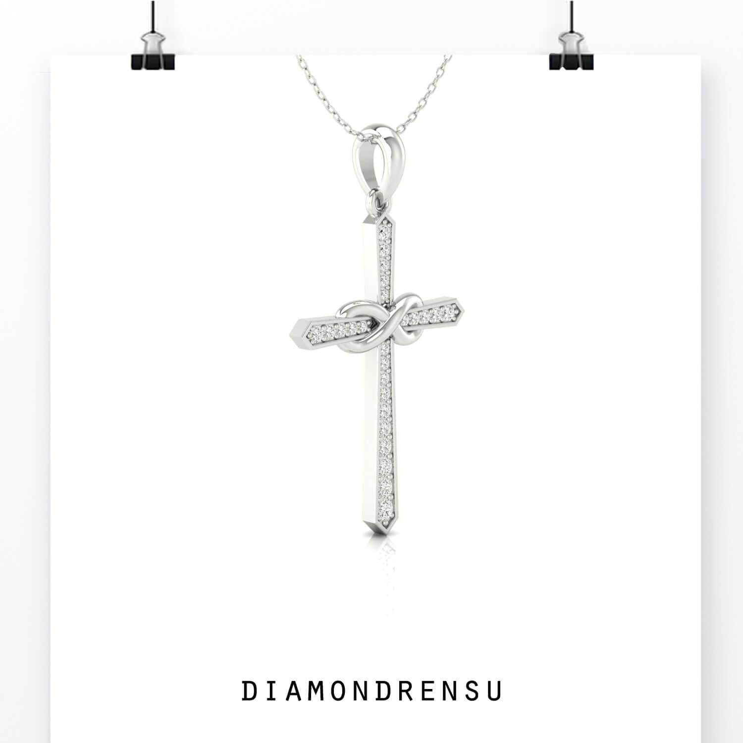 Shared prong setting pendant featuring an infinity cross design.