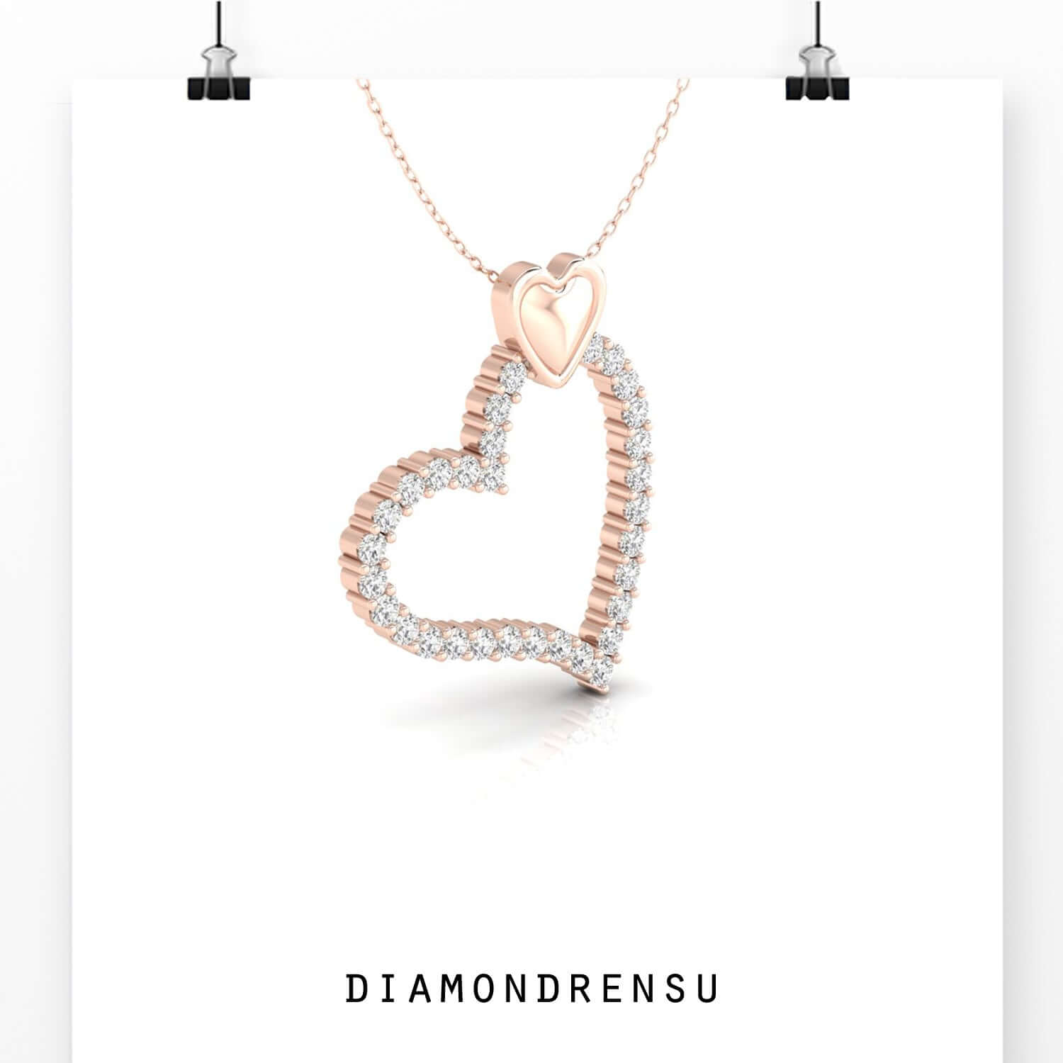 Rose gold pendant featuring intertwined heart shapes.