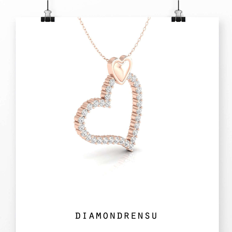 Rose gold pendant featuring intertwined heart shapes.