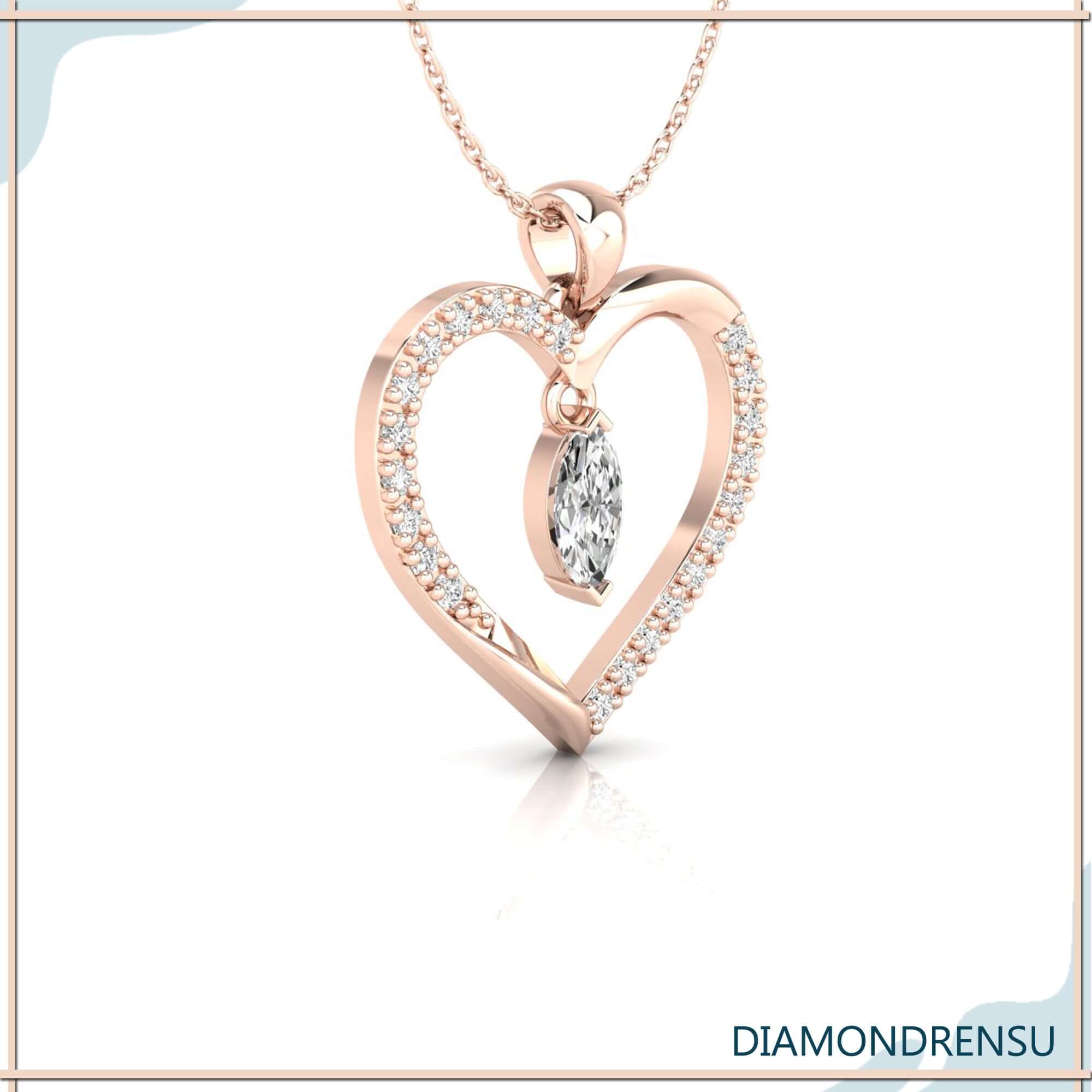 Handmade jewellery pendant in gold with unique heart motif.