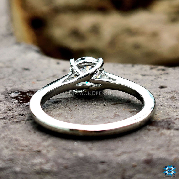 Four claw prong Portuguese cut engagement ring.