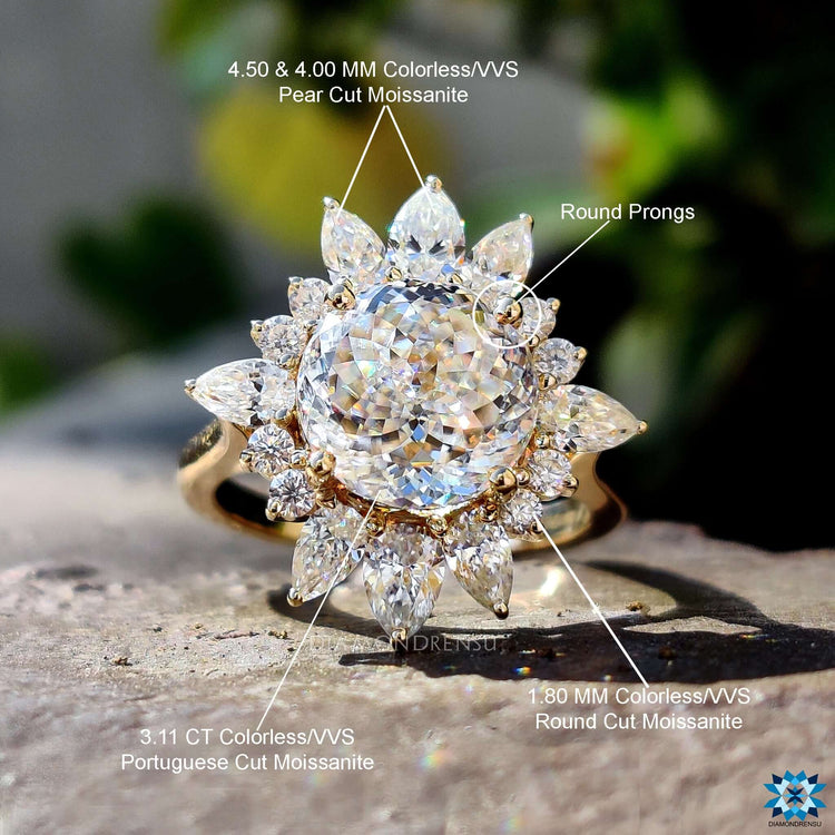 Portuguese cut moissanite with pear and round halo stones.