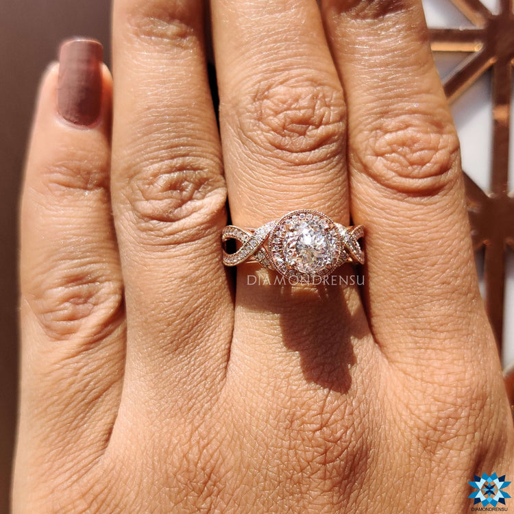 Rose gold ring with Portuguese cut moissanite center.