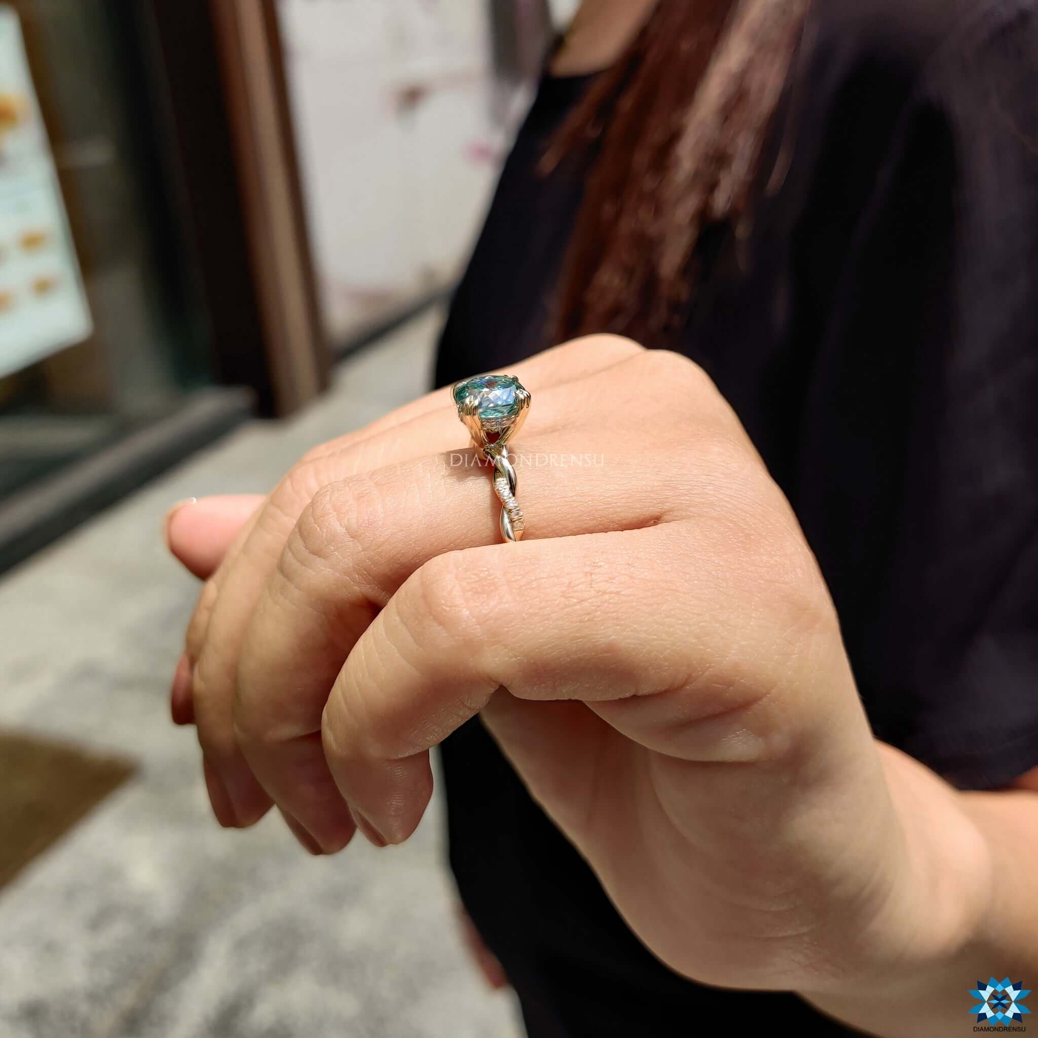 Twisted pave setting moissanite ring.