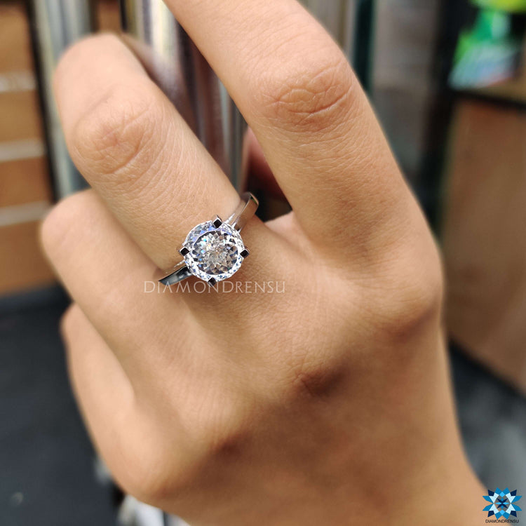 Portuguese cut moissanite ring handcrafted in white gold.