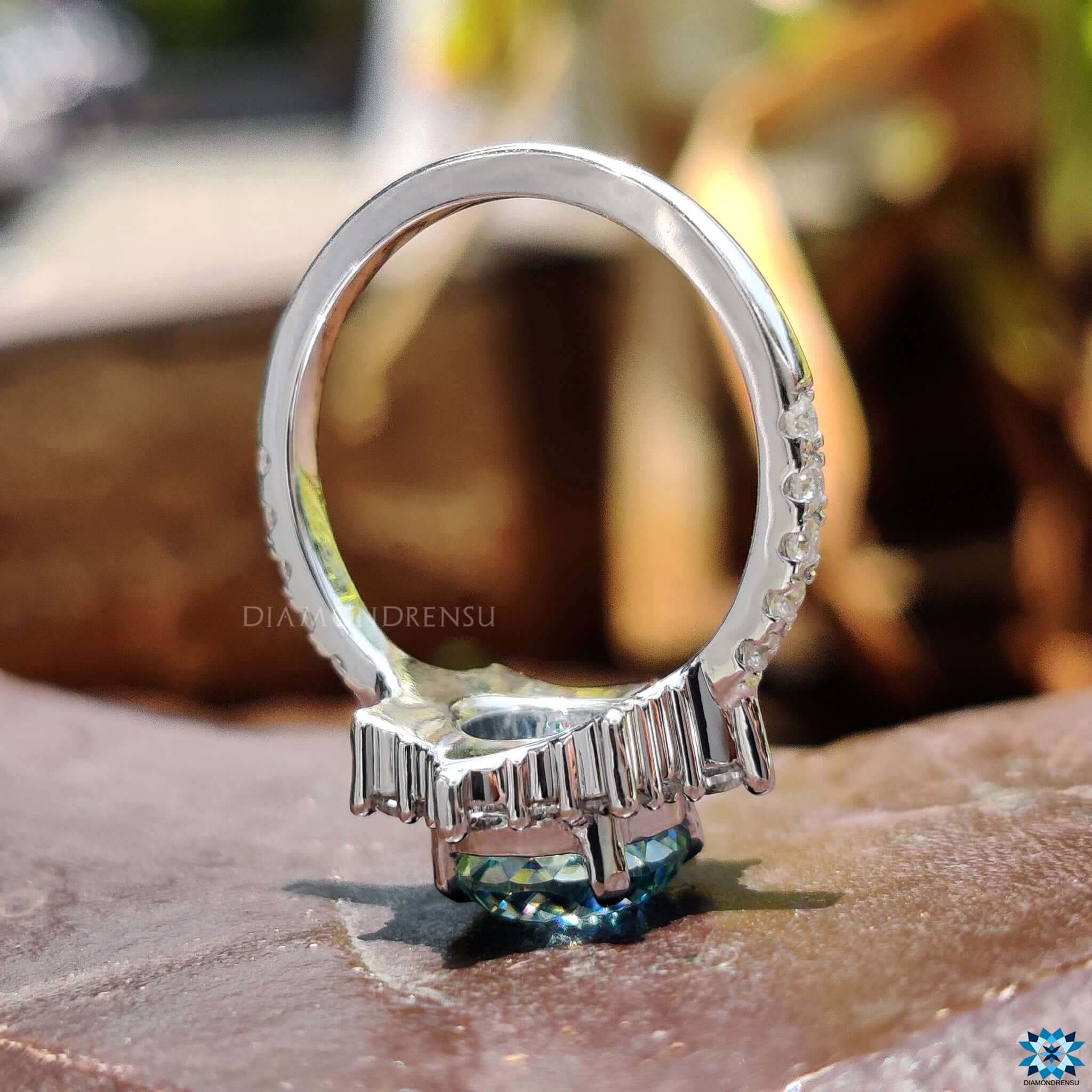 Elegant halo ring with round Portuguese cut stone.
