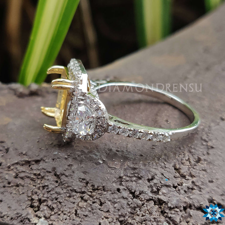 Moissanite halo ring with round cut halo setting.