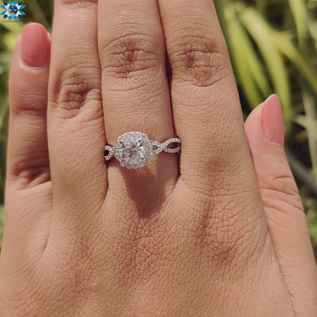 Round halo moissanite ring in a twisted band style.