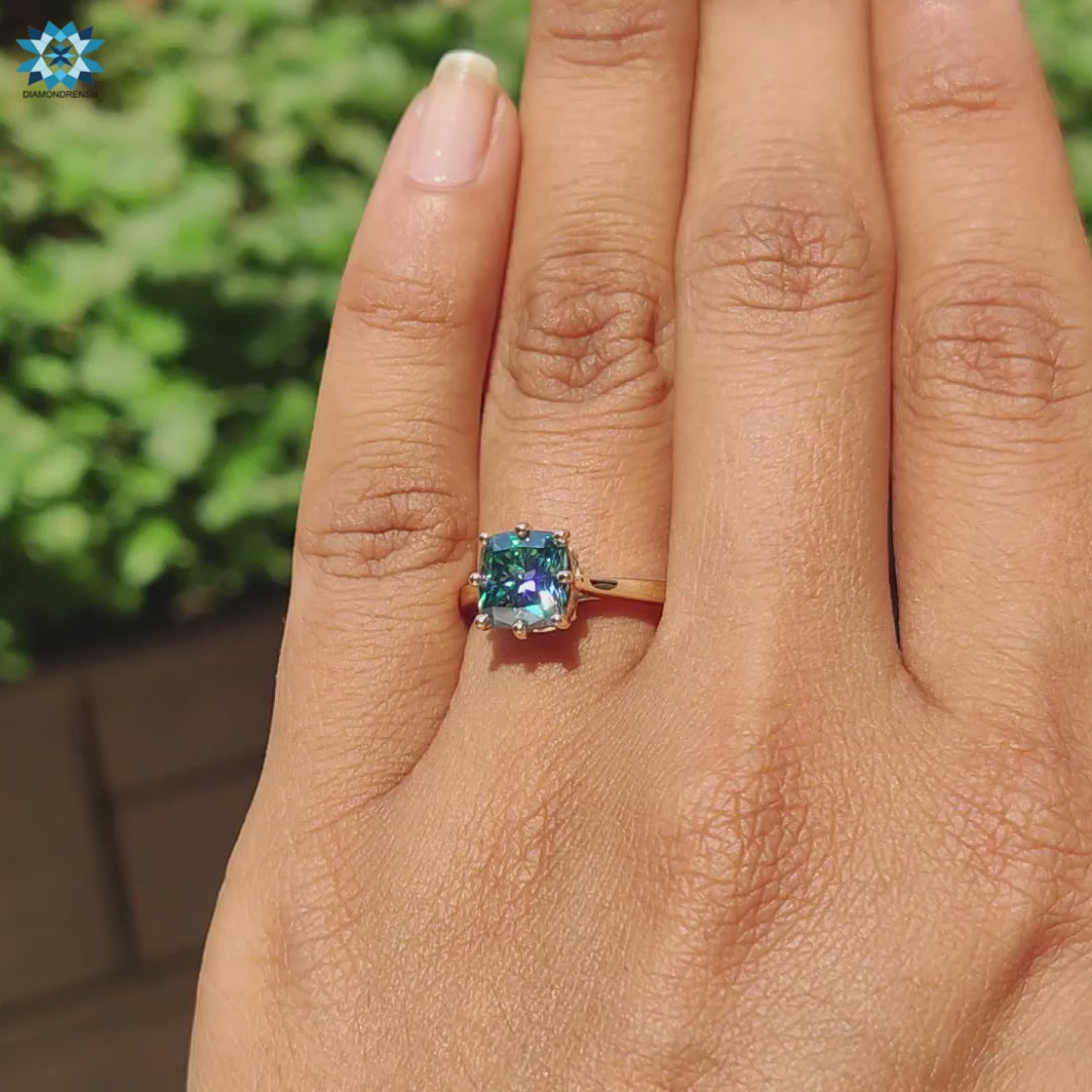 8 round prong setting holds cushion cut cyan blue moissanite securely.