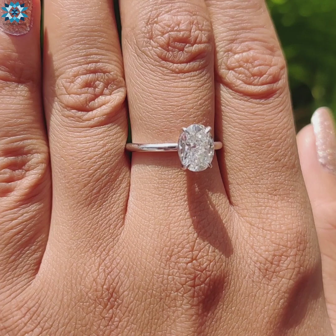 Handmade jewelry with oval moissanite solitaire.