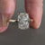 Diamond ring UK featuring a lab-grown elongated cushion diamond and claw prongs.