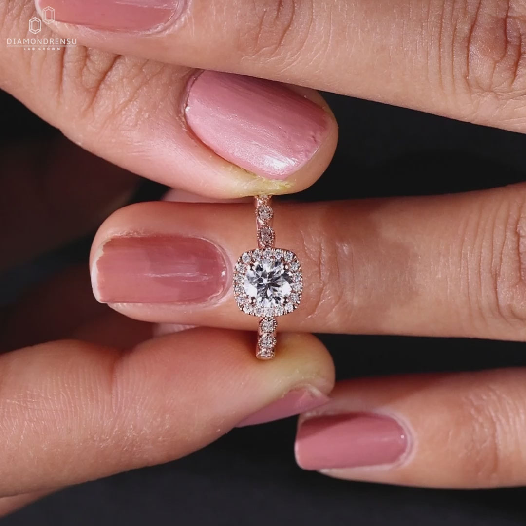 Milgrain diamond ring with prong setting and IGI certified diamonds.