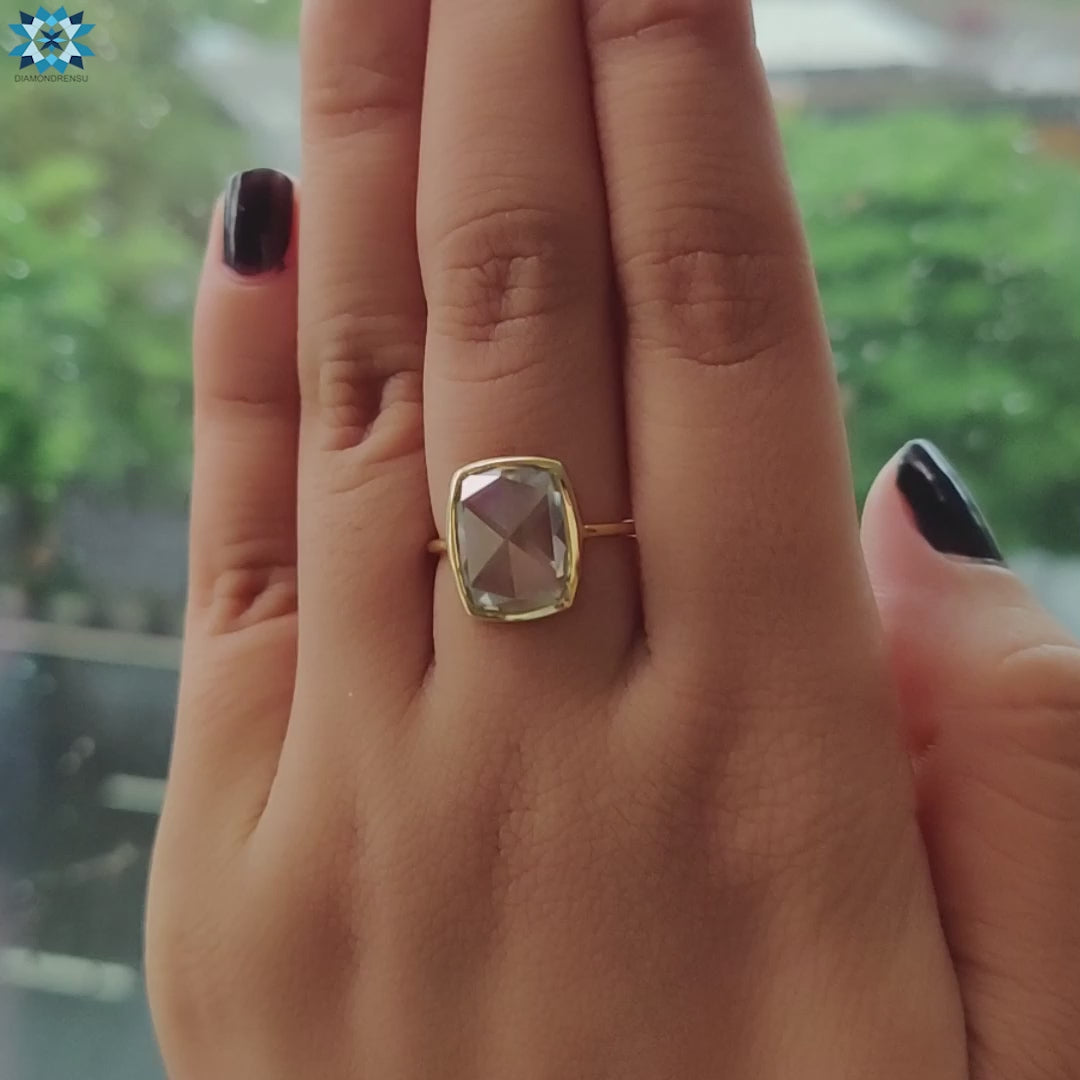 Elongated cushion moissanite ring for a custom engagement.