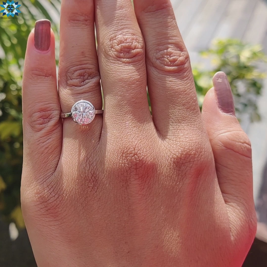 Handmade ring with white gold bezel set Moissanite for modern elegance.