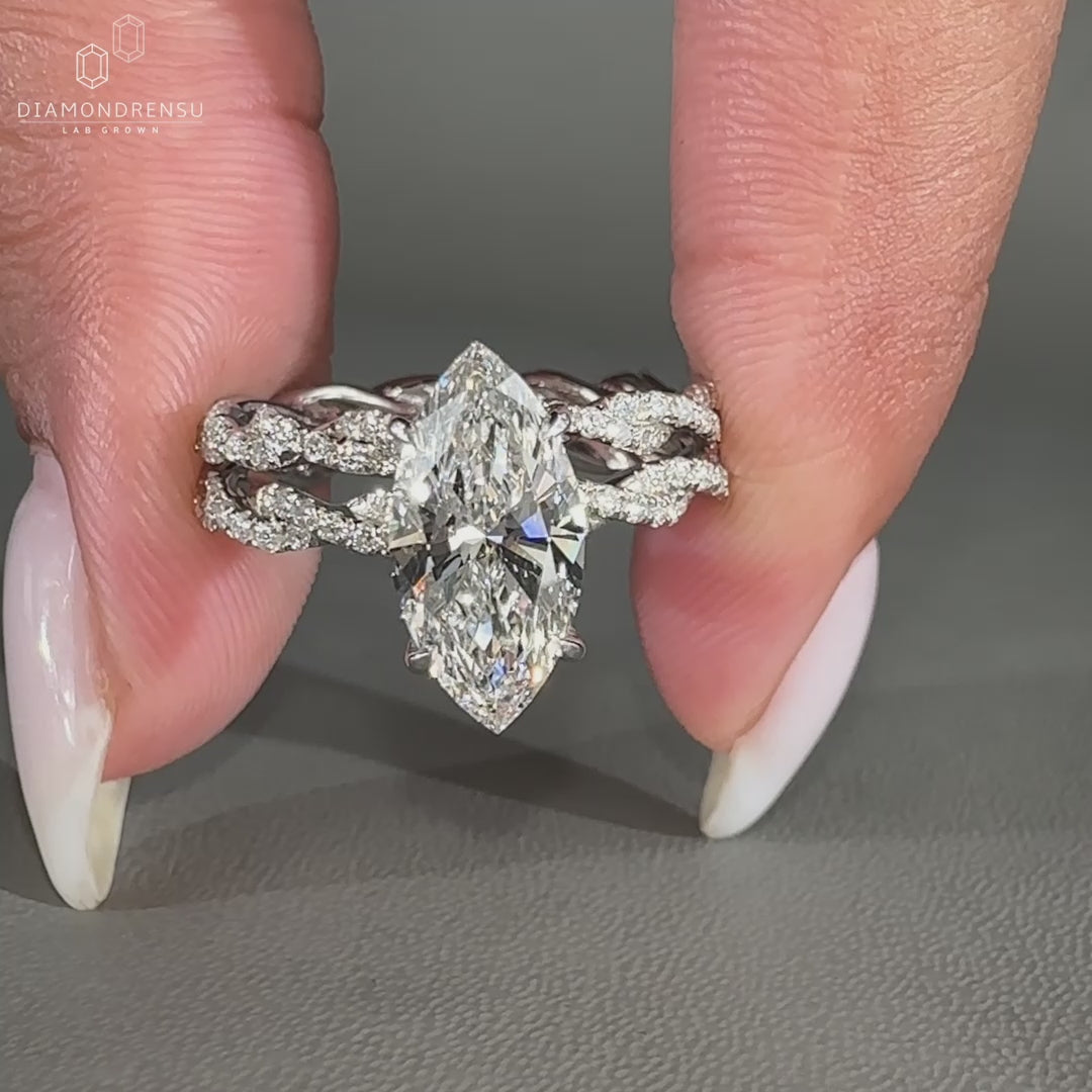 Hidden halo ring with twisted pave band in a white gold bridal set.