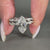 Hidden halo ring with twisted pave band in a white gold bridal set.