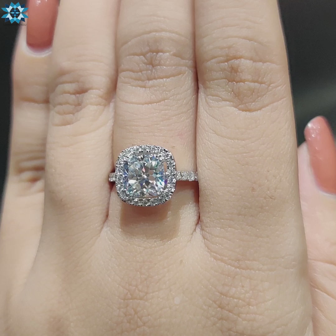 Handmade ring crafted in white gold with halo cushion moissanite.