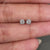 Round diamond stud earrings in white gold.