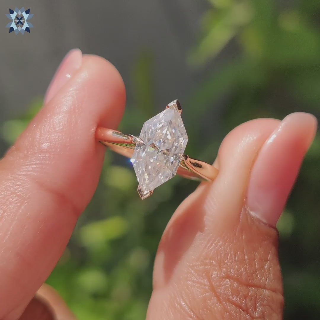 Handmade moissanite solitaire ring featuring a Dutch marquise cut and cathedral setting.