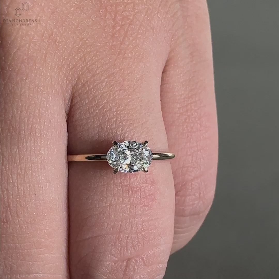 East west engagement ring with an east west diamond ring design, creating a striking and sophisticated look.