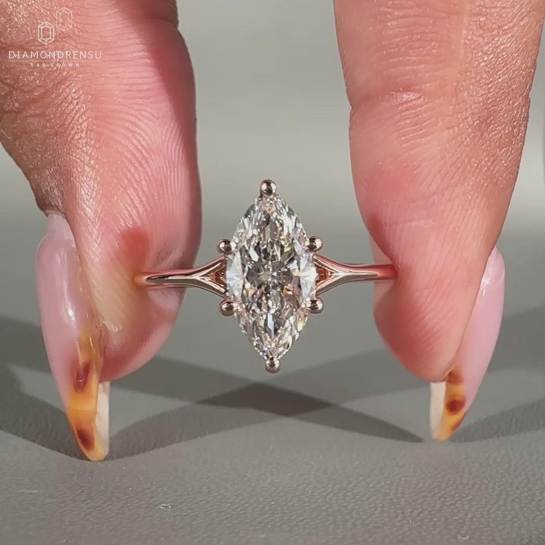 Solitaire marquise diamond ring with prong setting