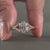 UK engagement ring crafted with a cushion cut diamond elongated design and claw prong setting for elegance.