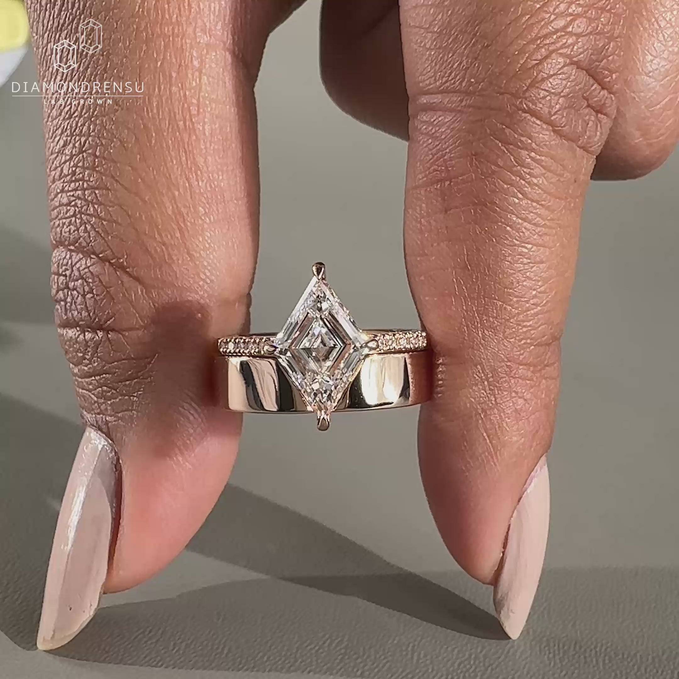 Lozenge cut ring set in a delicate pave setting for a modern bridal look.