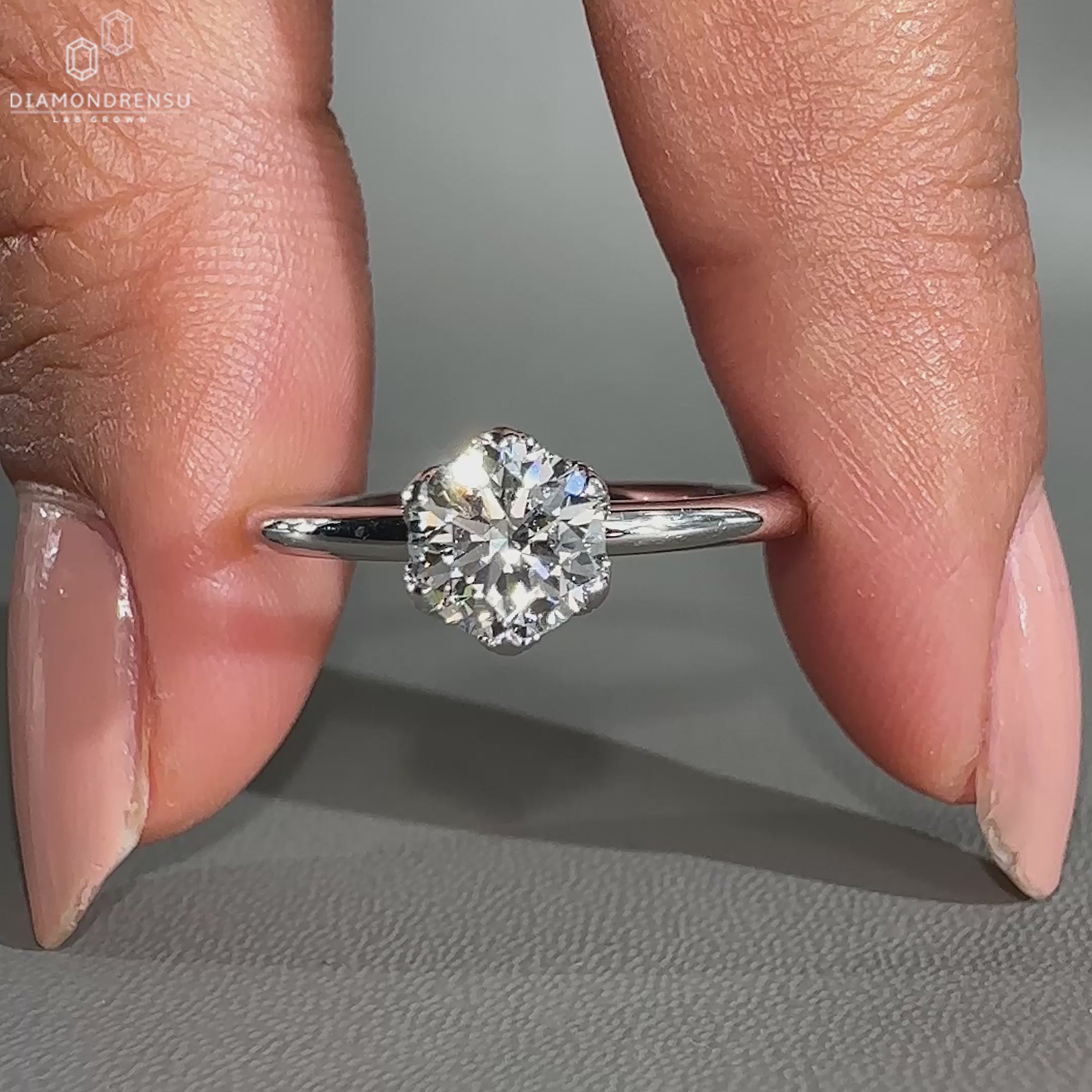 Nature inspired ring paired with round solitaire ring.