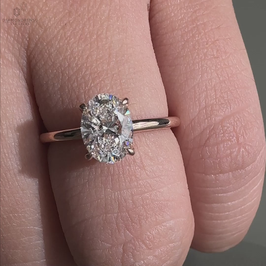 Round cut halo ring featuring claw prong ring setting.