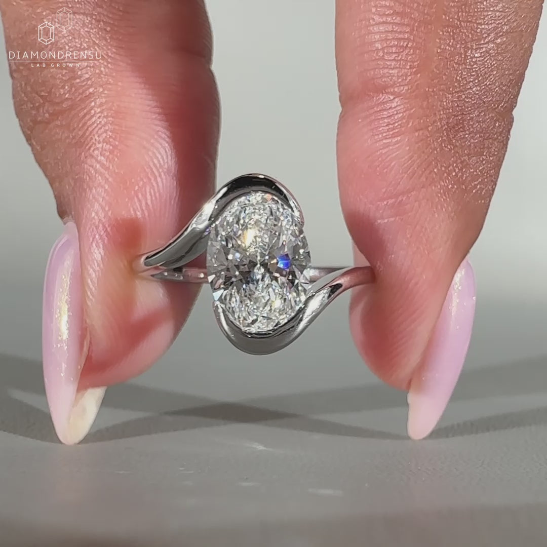 Oval diamond ring set in white gold.