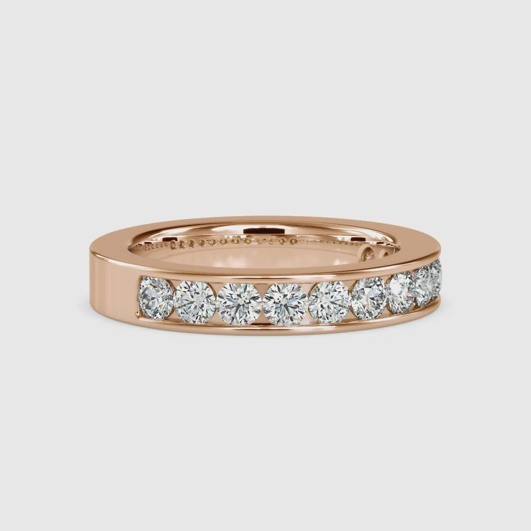 Round cut diamond channel band by Diamondrensu UK.