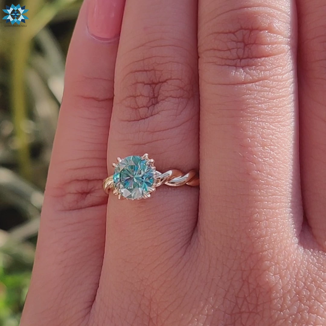 Twisted band engagement ring with hidden halo and round stone.